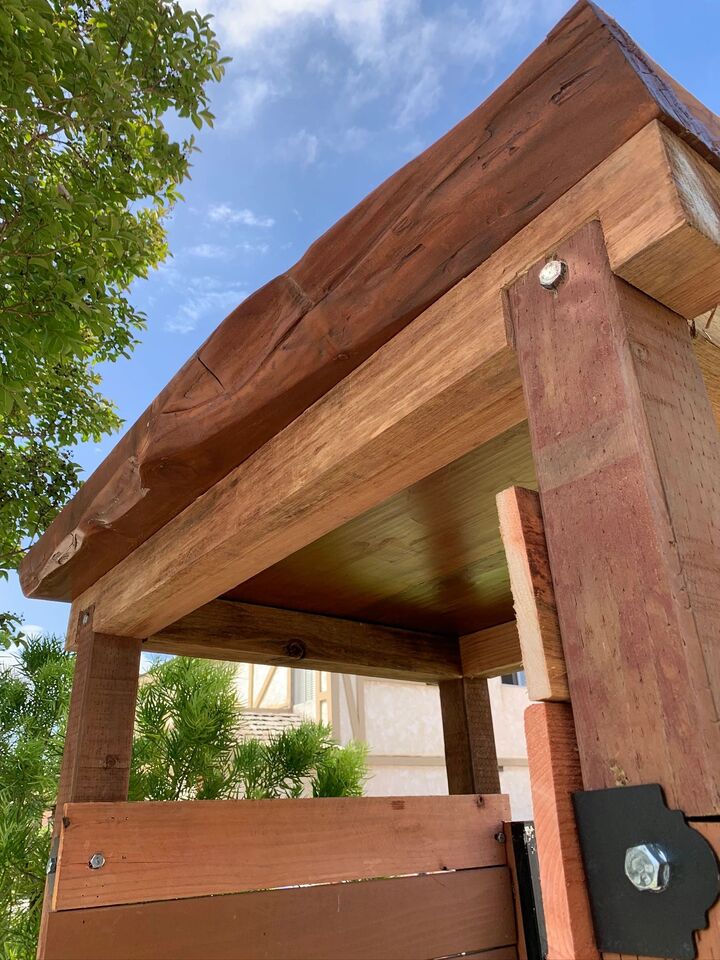 Underside detail of the timber arbor showing the notched joint where the beam meets the post