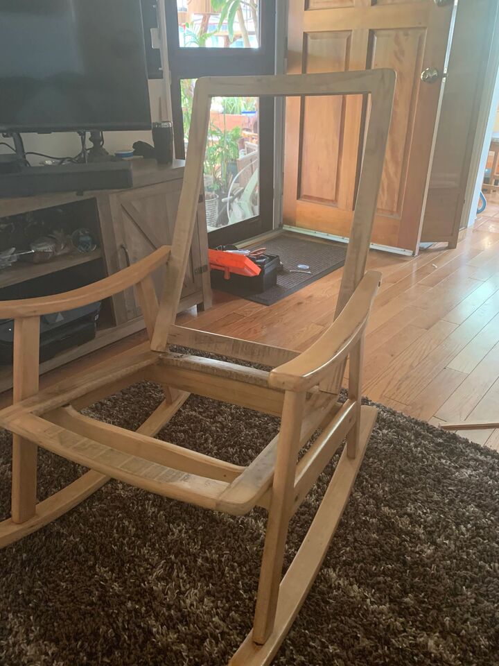 Rocking chair frame in a living room during the rebuild, before the weave was completed